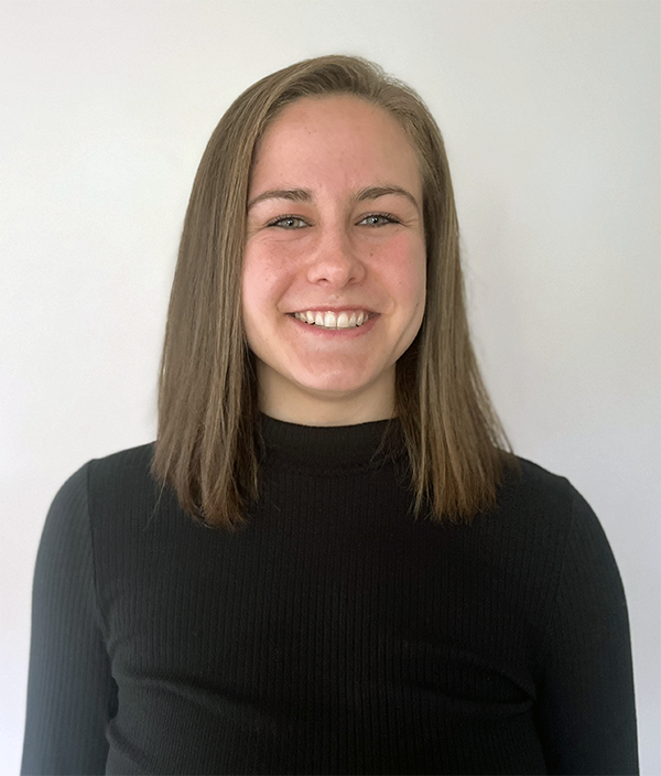 Haley Keglovits headshot; she is wearing a black sweater with a blank background.