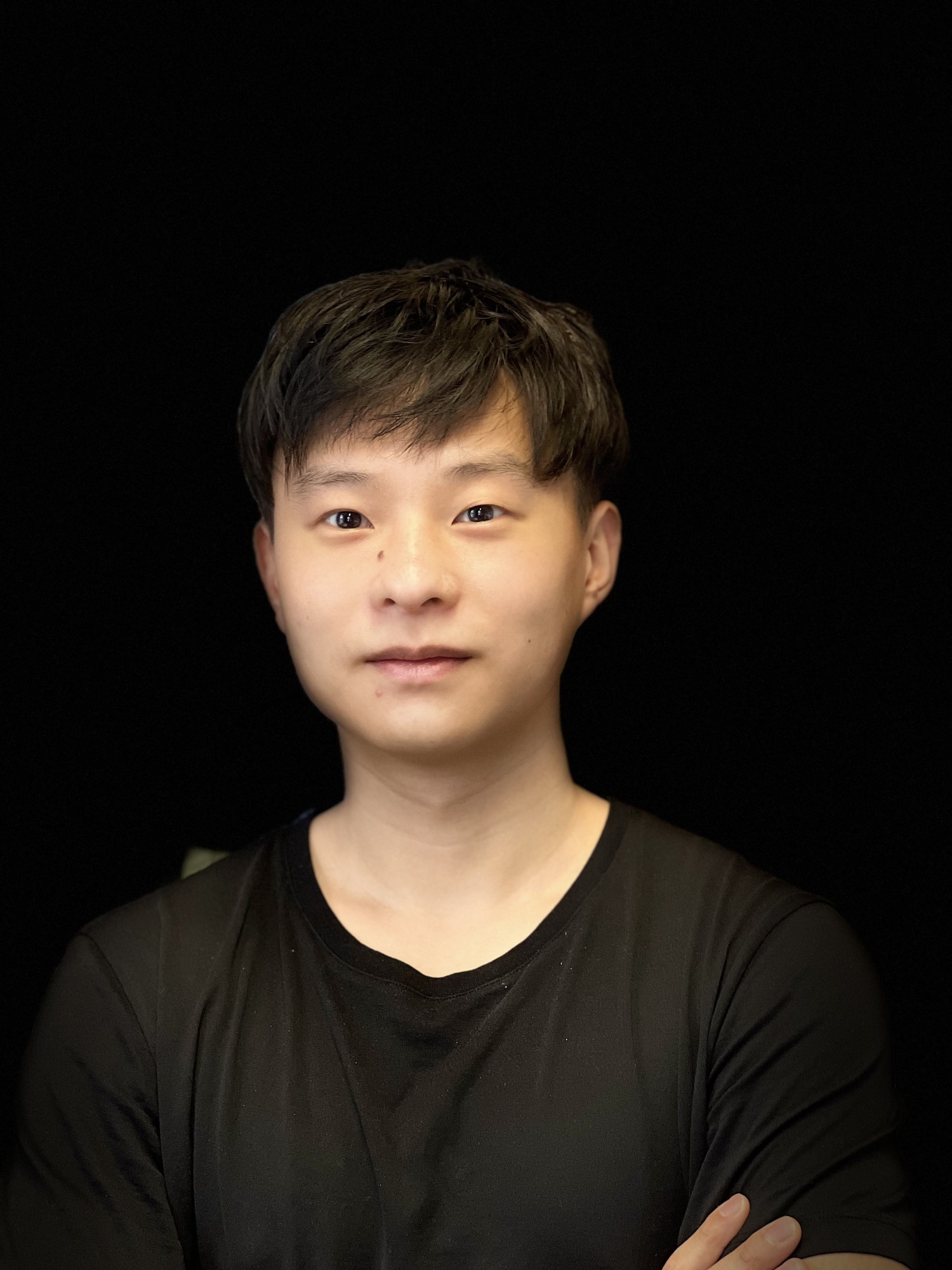 Kevin Hu headshot with a black background