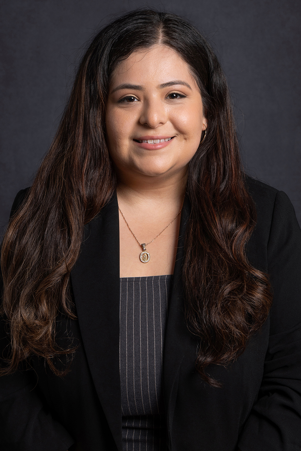 Kimberly Meza, a doctoral candidate in the Pathobiology program, smiling and wearing a black blazer.