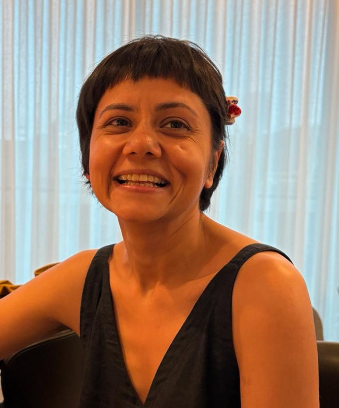 Portrait of Katyayni Seth, a doctoral candidate in Anthropology, smiling warmly while looking toward the camera