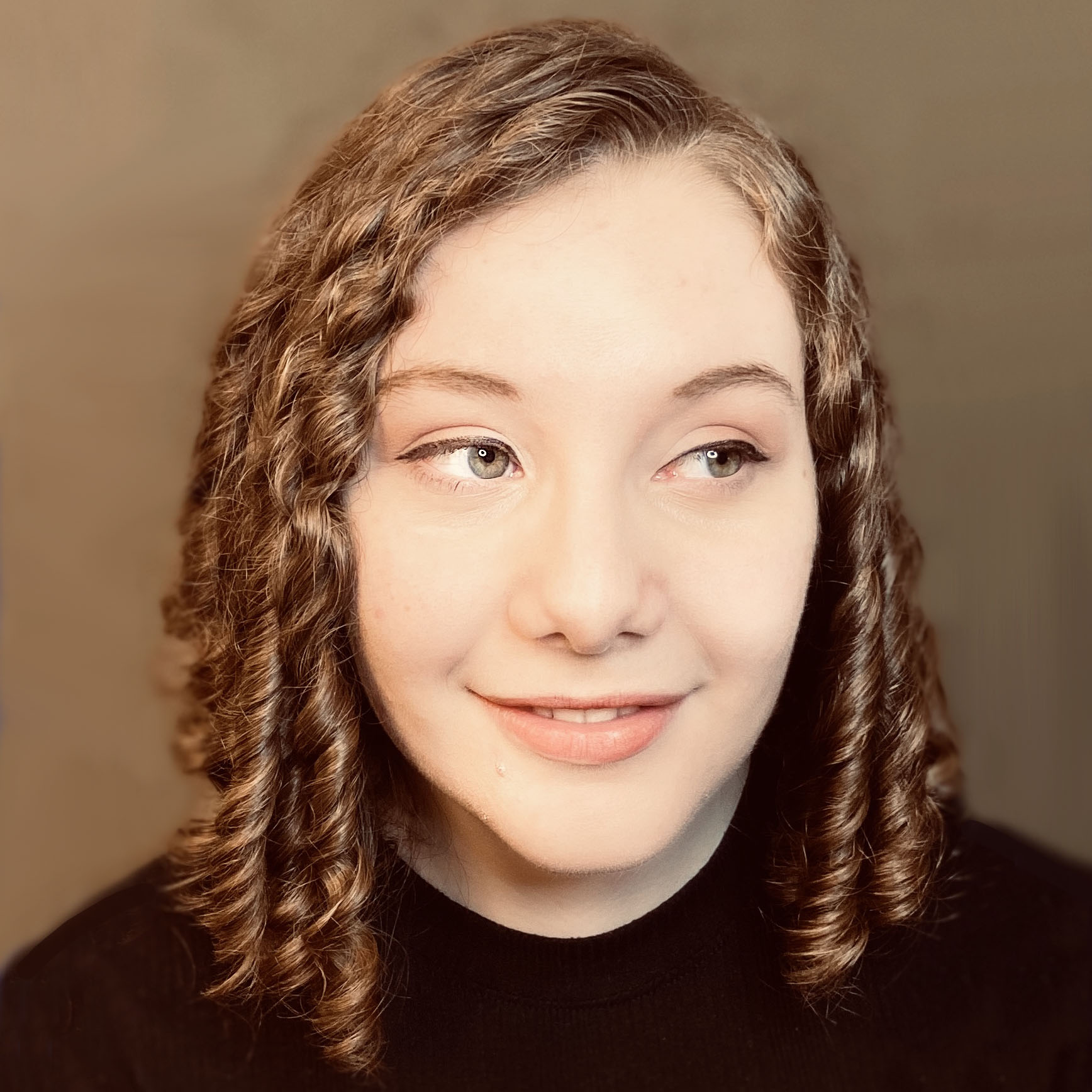 Heather Valera, a Ph.D. candidate in Molecular Biology, Cell Biology and Biochemistry, smiling and looking toward the camera.