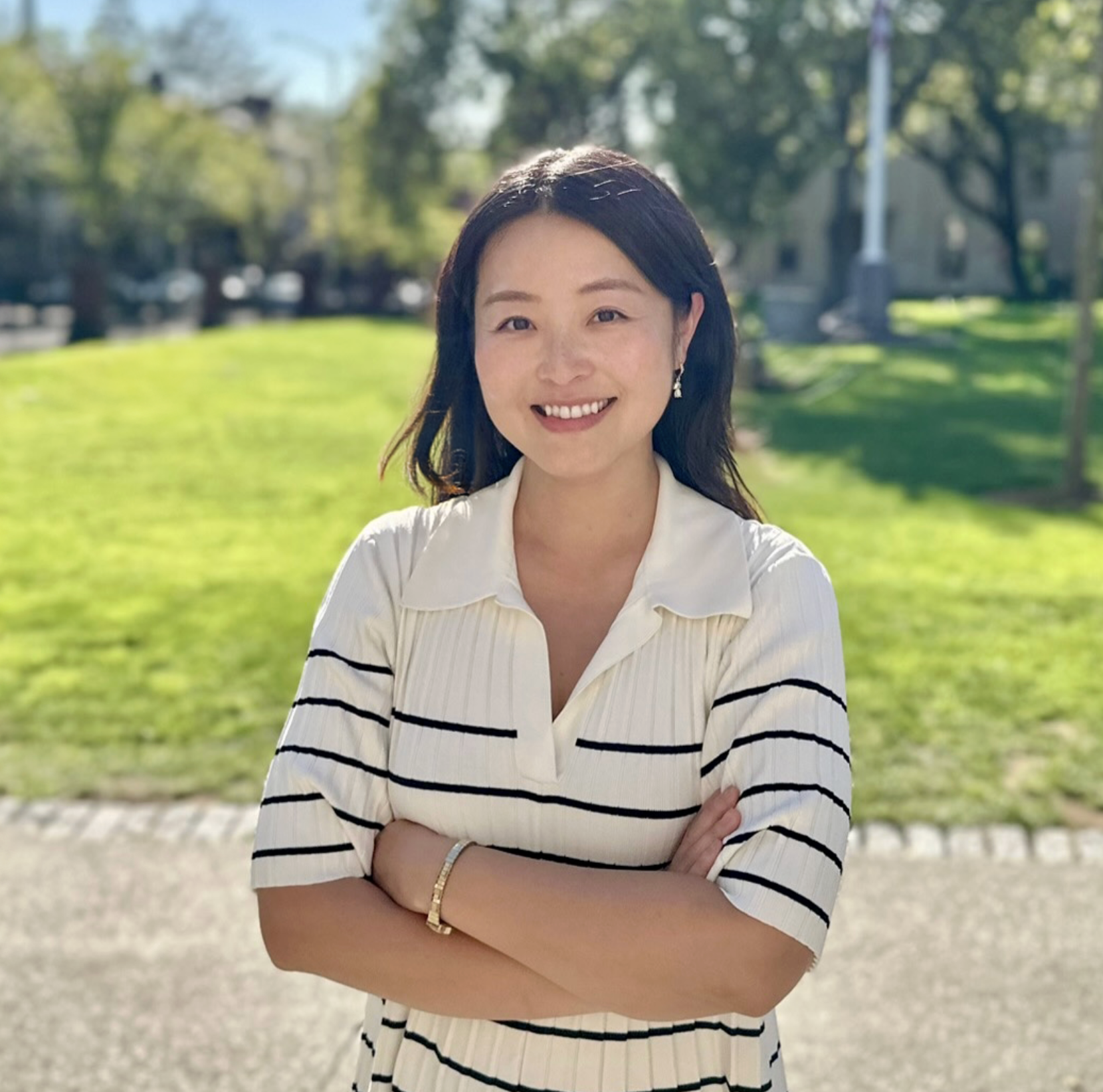Alice Xia, a fifth-year Ph.D. candidate in Cognitive and Psychological Sciences, smiling while looking at the camera, wearing a light-colored top.