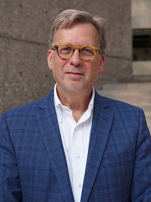 headshot of David Lindstrom in a dark jacket and white shirt