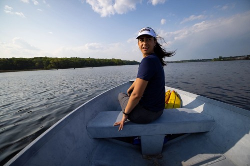Student in a rowing boat on a river