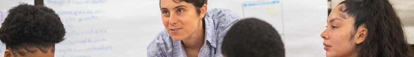 Teacher working with students