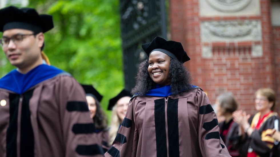 Graduate students in commencement attire