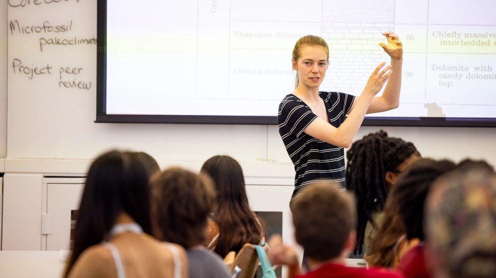Doctoral student teaching a lab