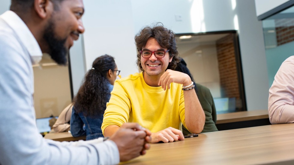 Staff sitting around a table